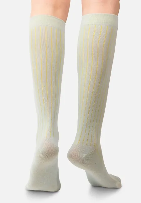 Light blue knee-high organic cotton socks with yellow stripes