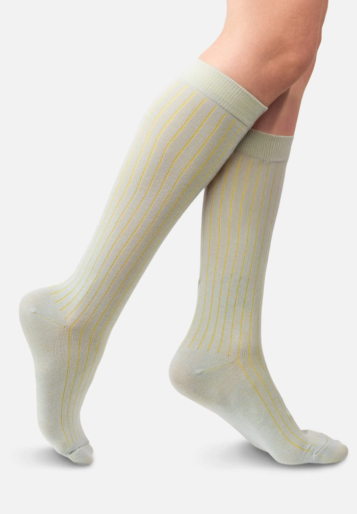 Light blue knee-high organic cotton socks with yellow stripes